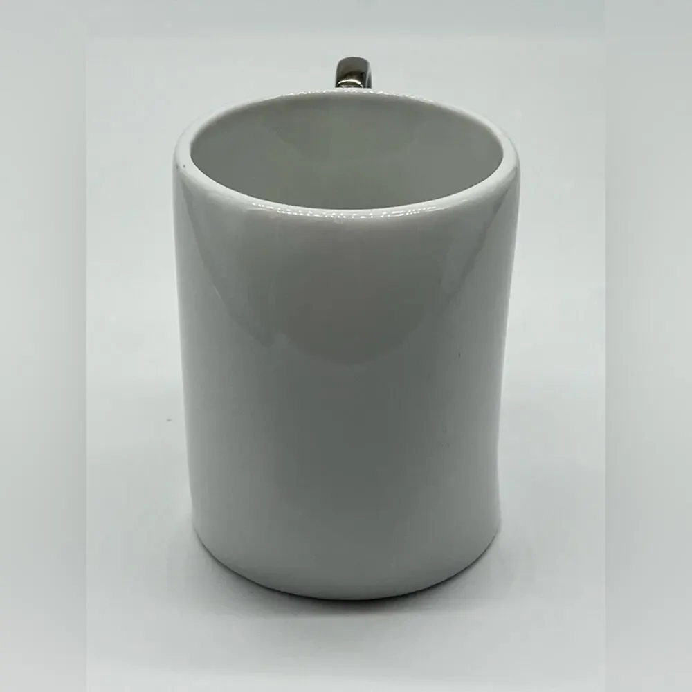 Brass knuckles coffee mug white and silver